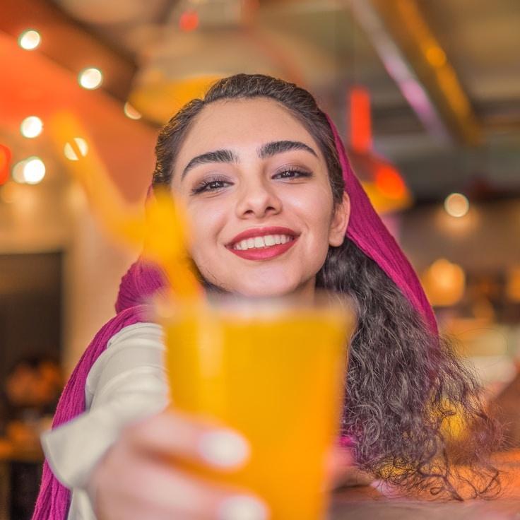 Avery Lin, Lead Design Curator at Pacific Sky Network, reviewing corporate floral arrangements
